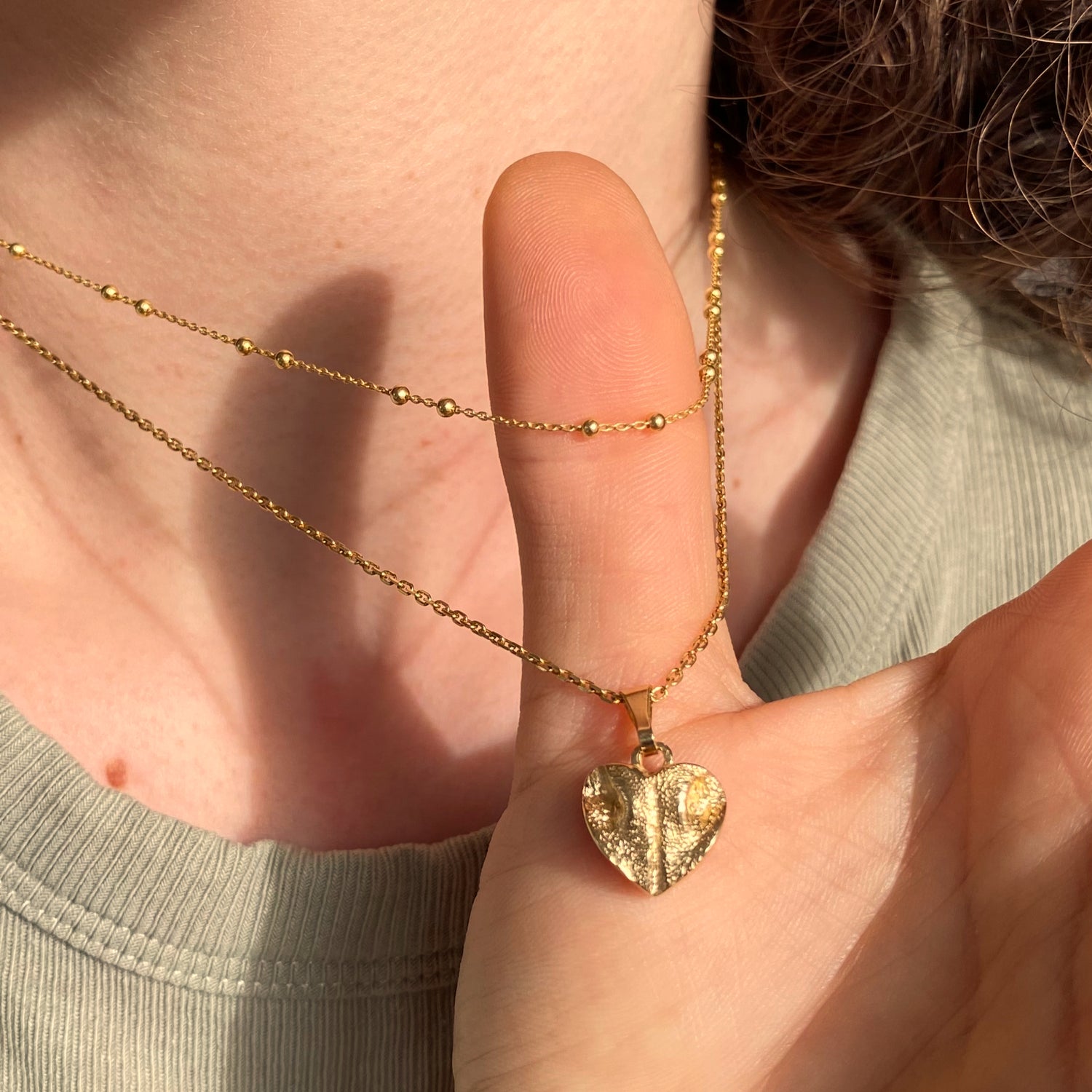 Halskette in kombination mit Erinnerungsschmuckkette mit Nasenabdruck in Gold